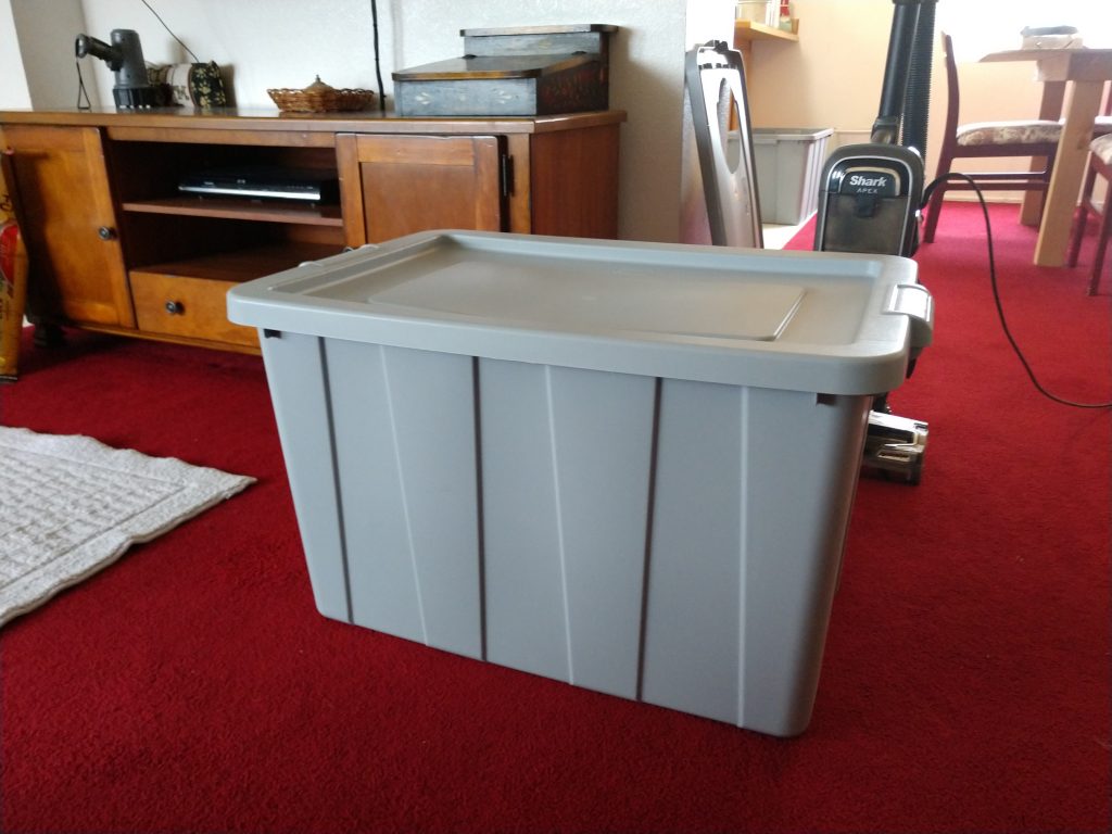 Picture of a 30 gallon plastic storage tub gray in color