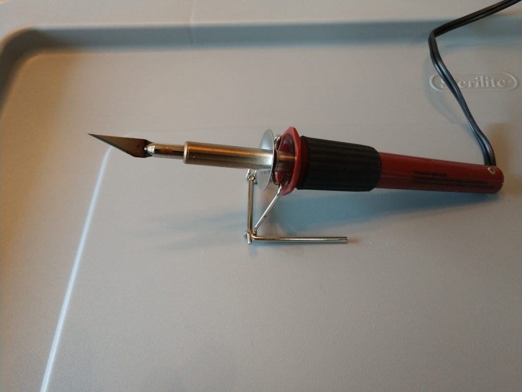 Picture of a electric soldering iron with an Exacto knife attachment.